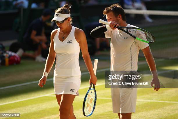 Alexander Peya of Austria and Nicole Melichar of The United States discuss tactics during the Mixed Doubles final against Jamie Murray of Great...