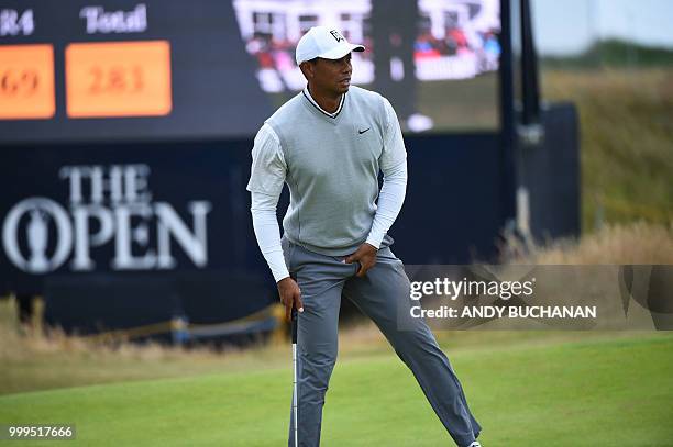 Golfer Tiger Woods gestures on the 2nd green during the first practice session at The 147th Open Championship at Carnoustie, Scotland on July 15,...