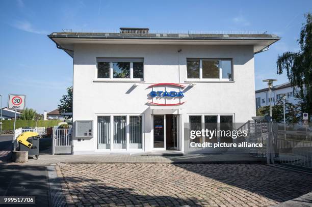 Plate with the Stada company logo is hanging above the entrance to the headquarter of drugmaker Stada in Bad Vilbel, Germany, 29 August 2017. The...