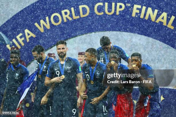 France players display their World Cup Winner's medals following the 2018 FIFA World Cup Final between France and Croatia at Luzhniki Stadium on July...