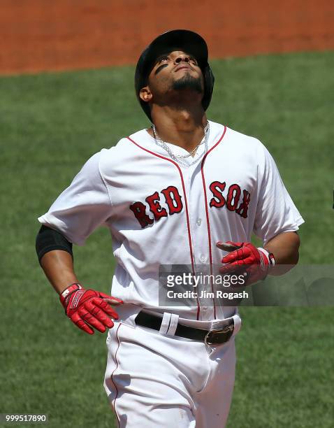 Xander Bogaerts of the Boston Red Sox reacts after he hit a home run against the Toronto Blue Jays in the first inning at Fenway Park on July 15,...