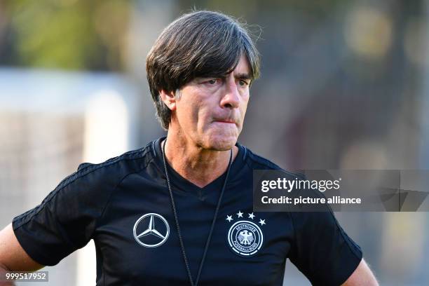 Germany's coach Joachim Loew is watching a training session of the German national soccer team on the training grounds of the soccer club...