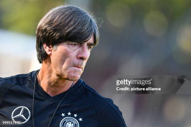 Germany's coach Joachim Loew is watching a training session of the German national soccer team on the training grounds of the soccer club...
