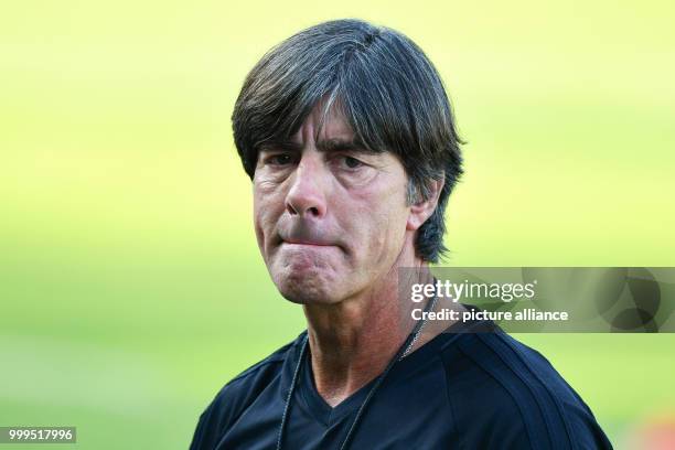 Germany's coach Joachim Loew is watching a training session of the German national soccer team on the training grounds of the soccer club...