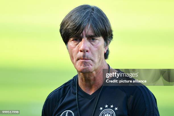 Germany's coach Joachim Loew is watching a training session of the German national soccer team on the training grounds of the soccer club...