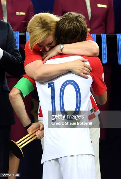 President of Croatia, Kolinda Grabar Kitarovic greets Luka Modric of Croatia as he is presented with his runners-up medal after the 2018 FIFA World...