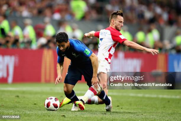 Nabil Fekir of France is challenged by Ivan Rakitic of Croatia during the 2018 FIFA World Cup Russia Final between France and Croatia at Luzhniki...