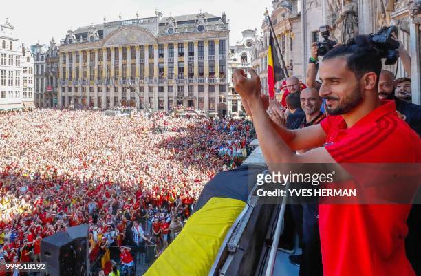 Belgium's Nacer Chadli celebrates at the balcony in front of more than 8000 supporters at the Grand-Place, Grote Markt in Brussels city center, as...