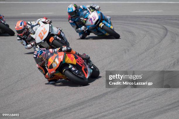 Brad Binder of South Africa and Red Bull KTM Ajo leads the field during the Moto2 race during the MotoGp of Germany - Race at Sachsenring Circuit on...