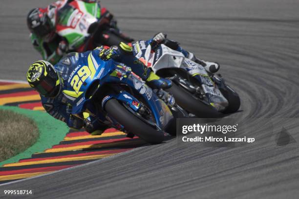 Andrea Iannone of Italy and Team Suzuki ECSTAR leads the field during the MotoGP race during the MotoGp of Germany - Race at Sachsenring Circuit on...