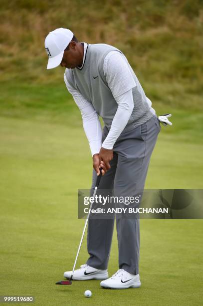 Golfer Tiger Woods putts on the 2nd green during the first practice session at The 147th Open Championship at Carnoustie, Scotland on July 15, 2018.