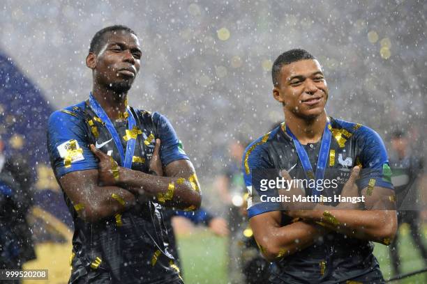 Paul Pogba and Kylian Mbappe of France celebrate victory following the 2018 FIFA World Cup Final between France and Croatia at Luzhniki Stadium on...