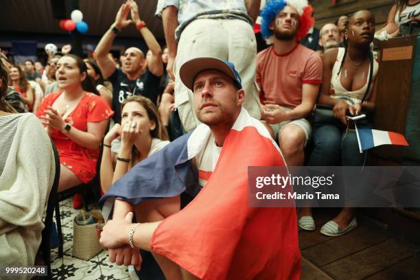 France fans watch the match at a French watch party at Liasion restaurant in Hollywood before France defeated Croatia in the World Cup final on July...