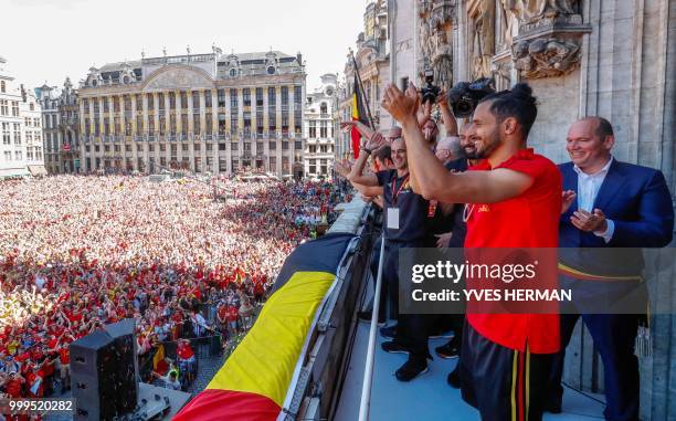 Belgium's Nacer Chadli celebrates at the balcony in front of more than 8000 supporters at the Grand-Place, Grote Markt in Brussels city center, as...