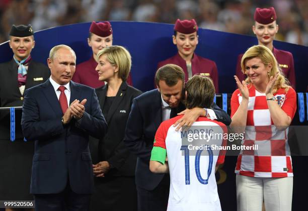 French President Emmanuel Macron hugs Luka Modric of Croatia as President of Russia Vladimir Putin and President of Croatia, Kolinda Grabar Kitarovic...