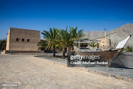 Old dhow in front of Khasab fort, Khasab, Musandam, Oman Old dhow in front of Khasab fort, Khasab, Musandam, Oman