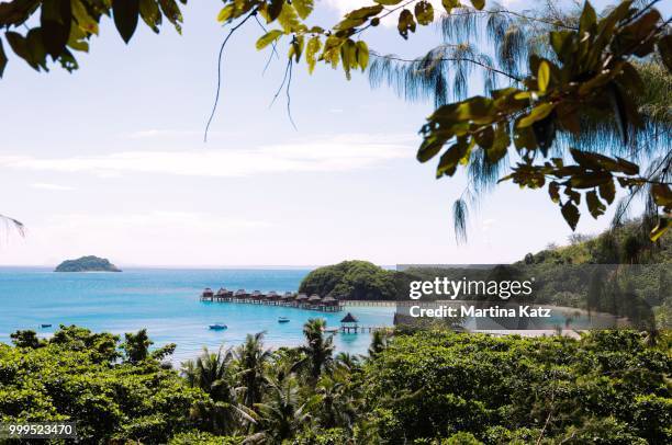 overwater bungalows in the sea, the south seas, malolo island, mamanuca islands, fiji - western division fiji stock pictures, royalty-free photos & images