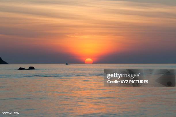 tropical sunset from ko lipe island, tarutao marine national park, satun province, thailand - ko lipe stock pictures, royalty-free photos & images