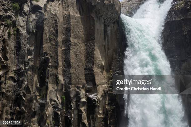basalt walls with waterfall salto de arco iris, maule valley, san clemente, maule, chile - arco stock pictures, royalty-free photos & images