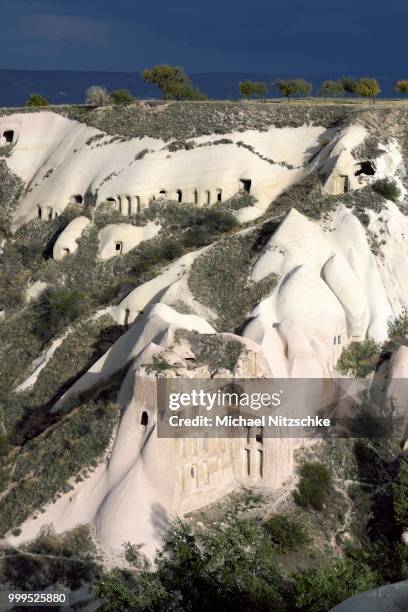 tufa formations with cave dwellings, pigeon valley, guevercinlik, nevsehir province, cappadocia, turkey - nevşehir province stock-fotos und bilder