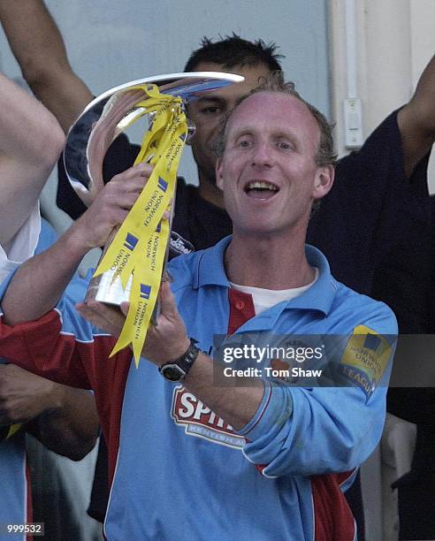 Captain Matthew Fleming of Kent celebrates with the trophy after winning the match and the league Warwickshire Bears v Kent Spitfires Norwich Union...