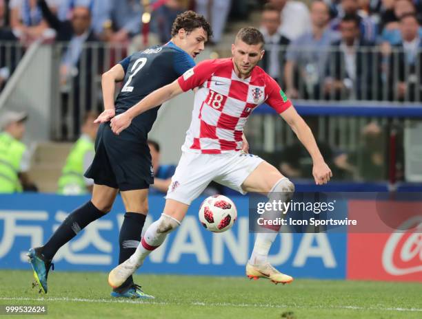 Forward Ante Rebic of Croatia National team and defender Benjamin Pavard of France National team during the final match between France and Croatia at...