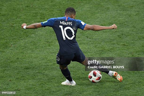 France's forward Kylian Mbappe scores a goal during the Russia 2018 World Cup final football match between France and Croatia at the Luzhniki Stadium...