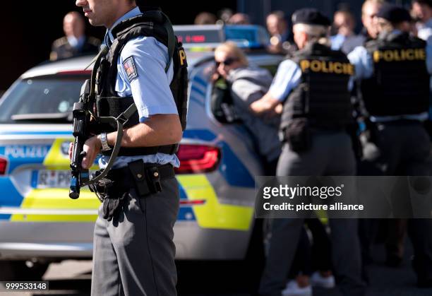 Bavarian and Czech police officers can be seen during a joint cross-border drill in Furth im Wald, Germany, 30 August 2017. The scenario performed is...