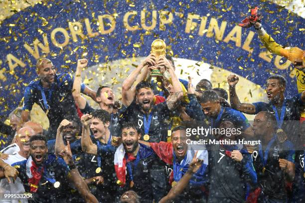 Olivier Giroud of France celebrates with the World Cup Trophy and his teammates following his sides victory in the 2018 FIFA World Cup Final between...