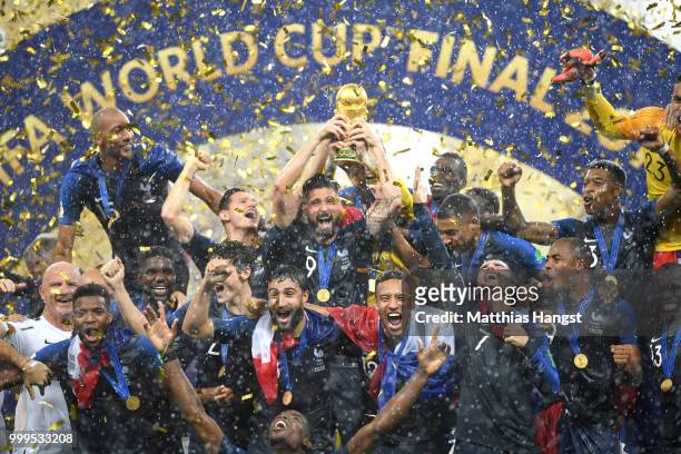 Olivier Giroud of France celebrates with the World Cup Trophy and his teammates following his sides victory in the 2018 FIFA World Cup Final between...