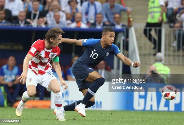 Kylian Mbappe of France in action against Luka Modric of Croatia during the 2018 FIFA World Cup Russia final match between France and Croatia at the...