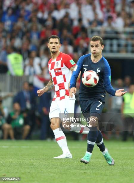 Antoine Griezmann of France in action against Dejan Lovren of Croatia during the 2018 FIFA World Cup Russia final match between France and Croatia at...