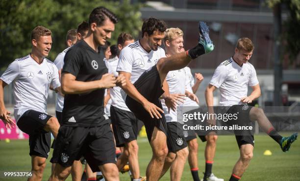 Several players, as well as Mats Hummels during a training session of the German men's national soccer team before a World Cup qualification match,...