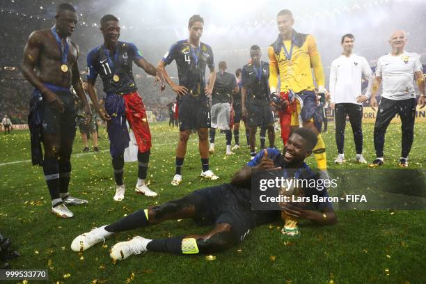 Samuel Umtiti of France celebrates victory with the World Cup trophy following the 2018 FIFA World Cup Final between France and Croatia at Luzhniki...