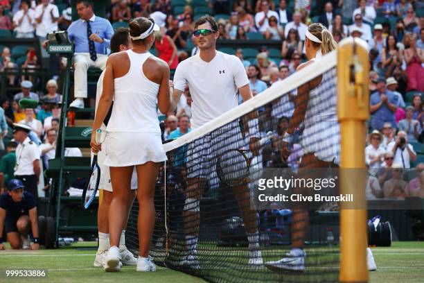 Alexander Peya of Austria and Nicole Melichar of The United States shakes hands with Jamie Murray of Great Britain and Victoria Azarenka of Belarus...