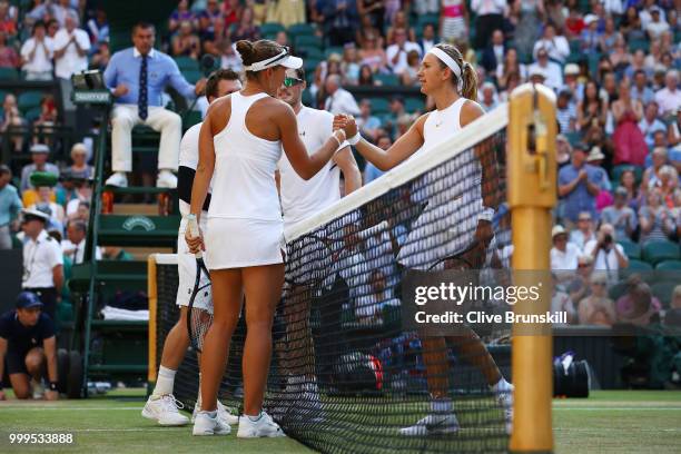 Alexander Peya of Austria and Nicole Melichar of The United States shakes hands with Jamie Murray of Great Britain and Victoria Azarenka of Belarus...