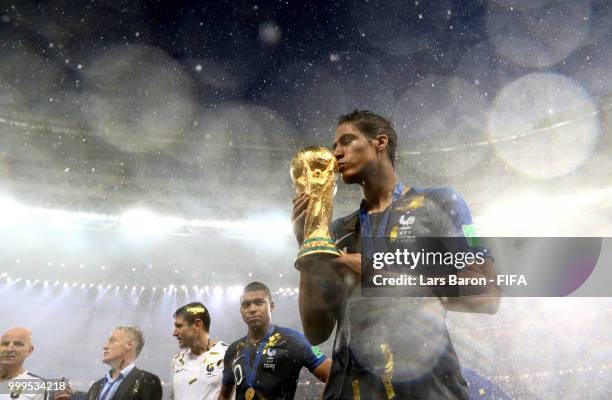 Raphael Varane of France kisses the World Cup trophy following the 2018 FIFA World Cup Final between France and Croatia at Luzhniki Stadium on July...