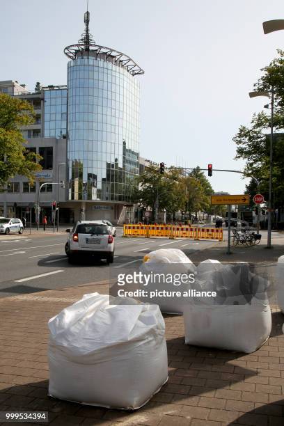 Sand filled plastic bags can be seen as a truck barrier at the Goethe Street in fron of the Schiller Galerie in Wolfsburg, Germany, 30 August 2017....