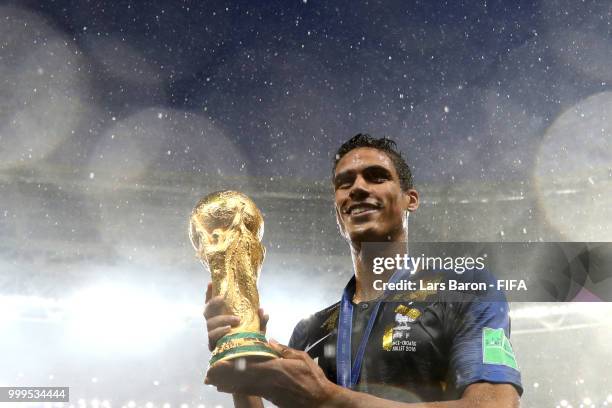 Raphael Varane of France holds the World Cup trophy following the 2018 FIFA World Cup Final between France and Croatia at Luzhniki Stadium on July...