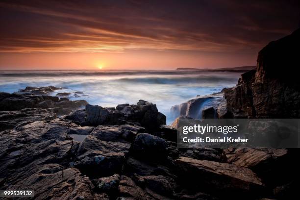 waves at high tide and sunset, isle of barra, outer hebrides, scotland, united kingdom - ハイランド諸島 ストックフォトと画像