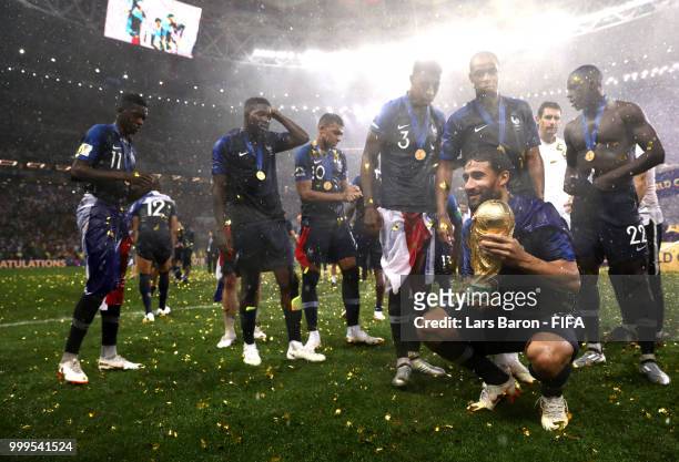 Nabil Fekir of France holds the World Cup trophy following the 2018 FIFA World Cup Final between France and Croatia at Luzhniki Stadium on July 15,...