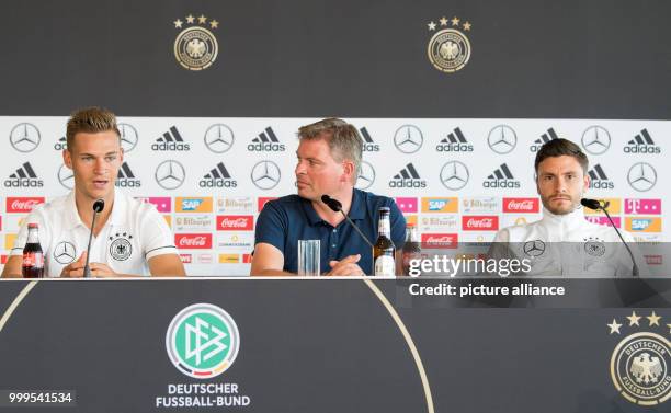 The German soccer player Joshua Kimmich , the speaker of the team Jens Grittner and the player Jonas Hector during a press conference held before the...