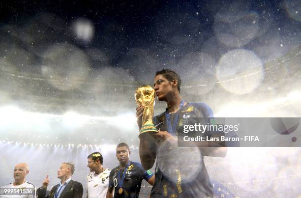 Raphael Varane of France kisses the World Cup trophy following the 2018 FIFA World Cup Final between France and Croatia at Luzhniki Stadium on July...