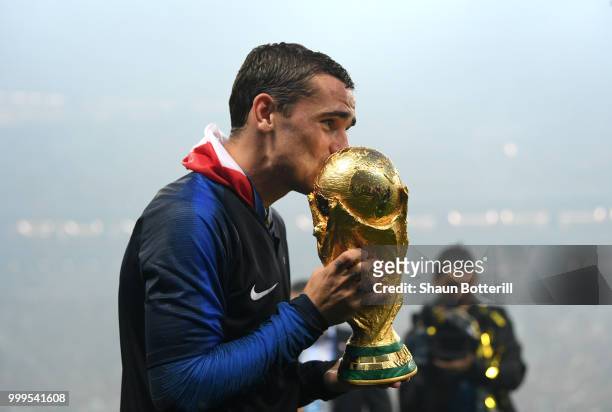 Antoine Griezmann of France kisses the World Cup trophy following the 2018 FIFA World Cup Final between France and Croatia at Luzhniki Stadium on...