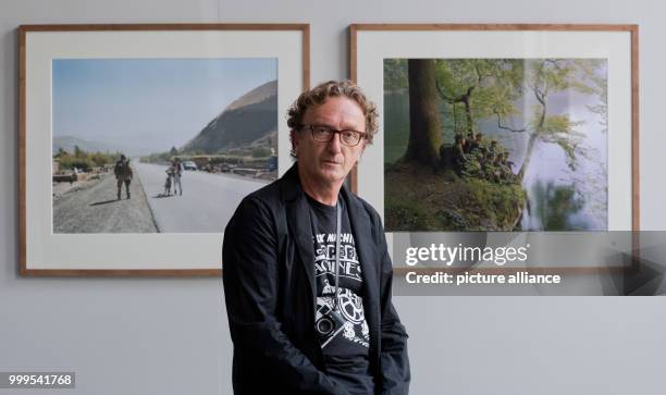 The photographer Jo Roettger shows photographs from his series "Quer zum Strom" at the gallery for photography in Hanover, Germany, 30 August 2017....