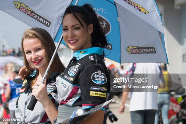 The grid girls pose on the pit during the pit walk during the MotoGp of Germany - Race at Sachsenring Circuit on July 15, 2018 in...