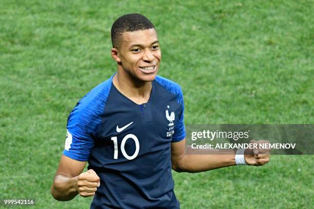 France's forward Kylian Mbappe celebrates after scoring a goal during the Russia 2018 World Cup final football match between France and Croatia at...