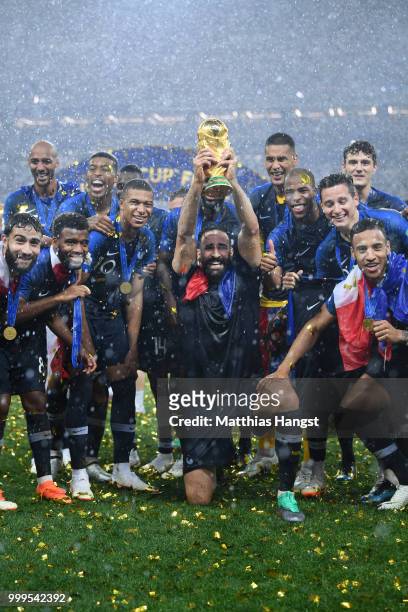 Adil Rami of France celebrates with the World Cup Trophy following his sides victory in during the 2018 FIFA World Cup Final between France and...