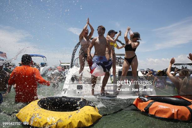 People react to France beating Croatia in the World Cup final as it is being broadcast from the Ballyhoo Media boat setup in the Intracoastal...