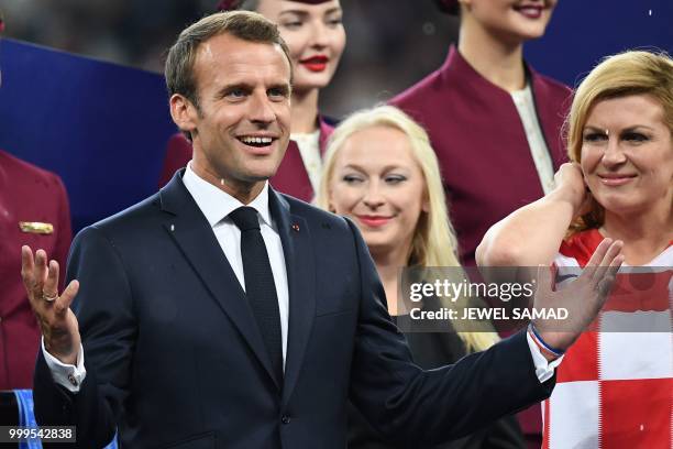 French President Emmanuel Macron gestures as he stands on stage at the end of the Russia 2018 World Cup final football match between France and...